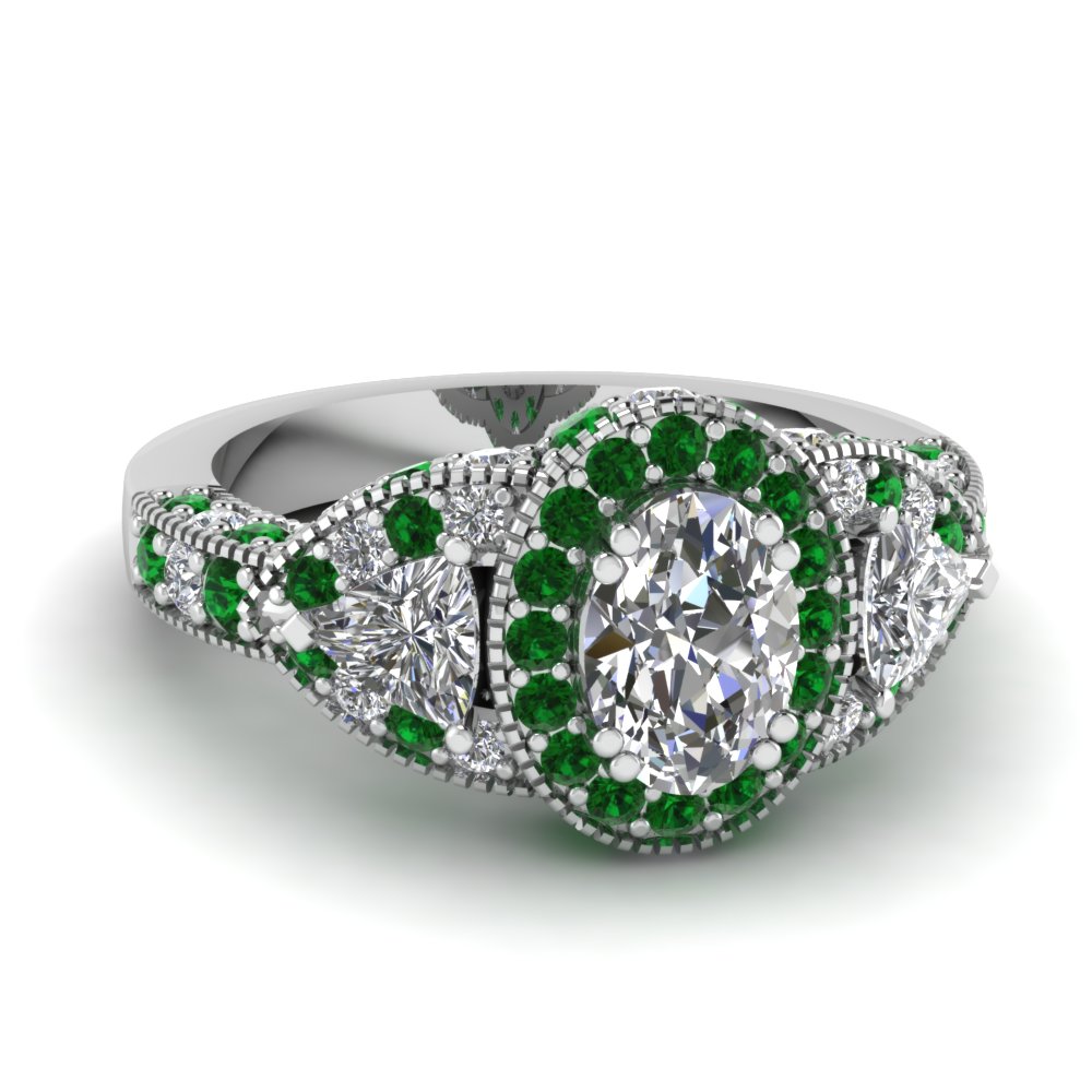 Engagement ring with green emerald