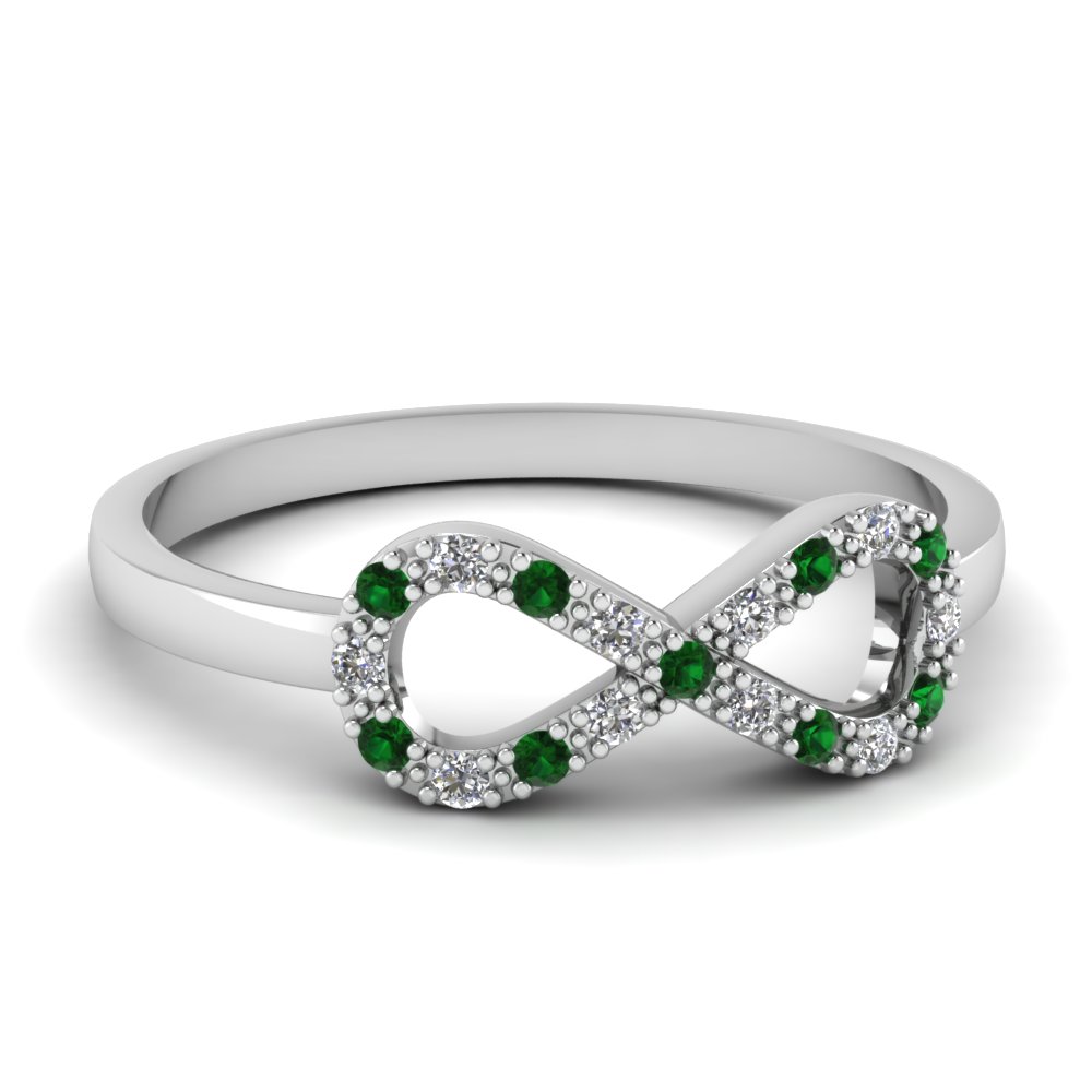 Engagement ring with green emerald