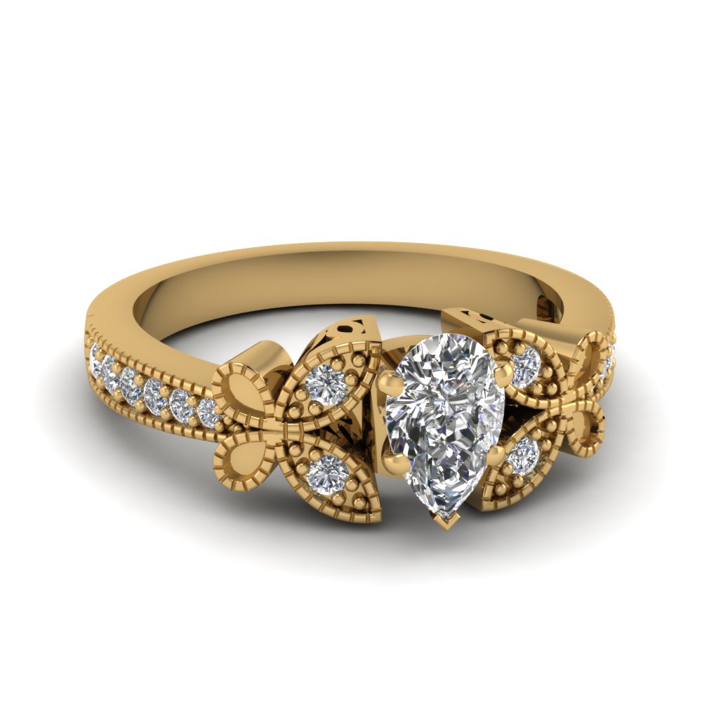 Pear shaped diamond engagement ring yellow gold